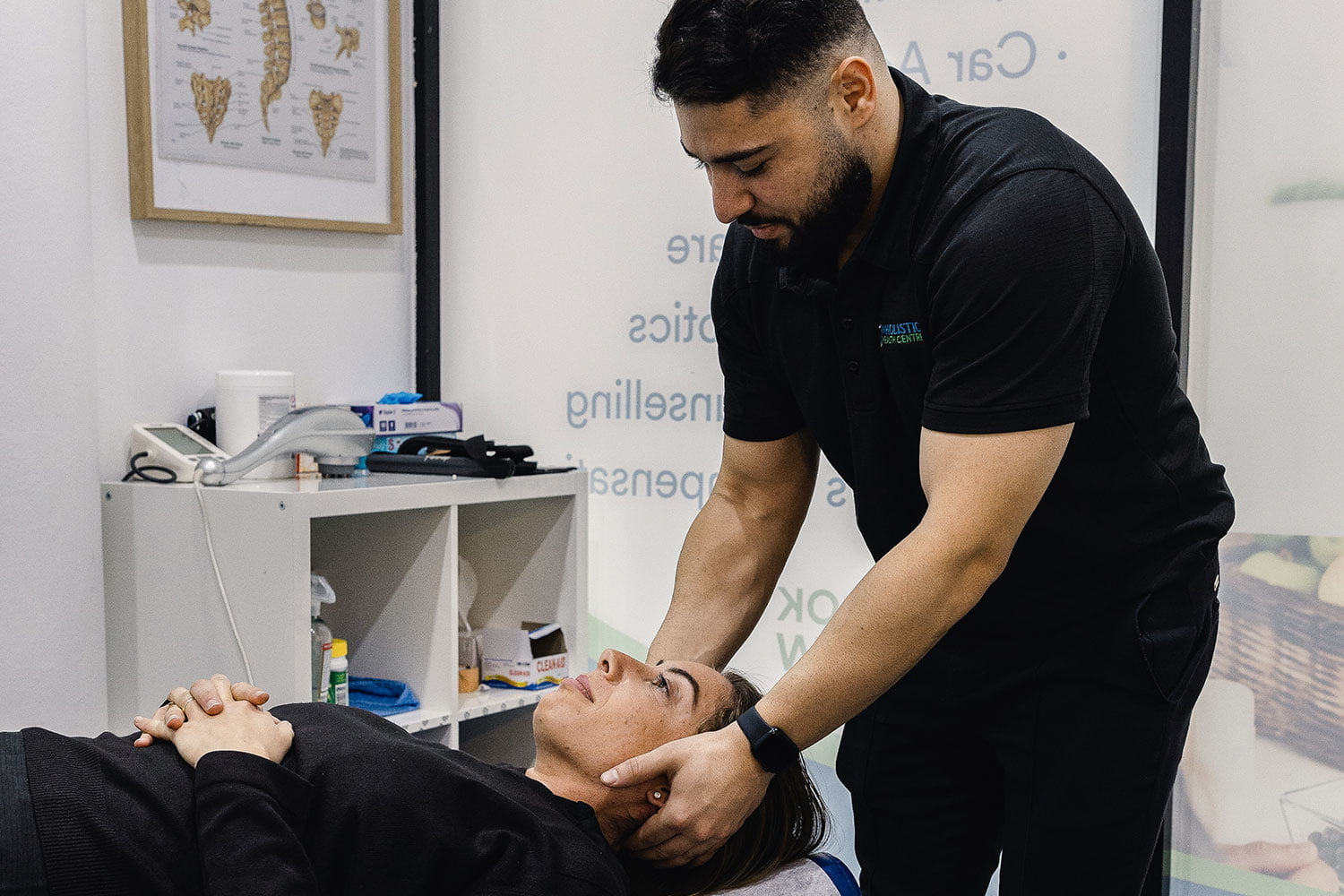 A patient receiving neck adjustment from our Wolli Creek chiropractor